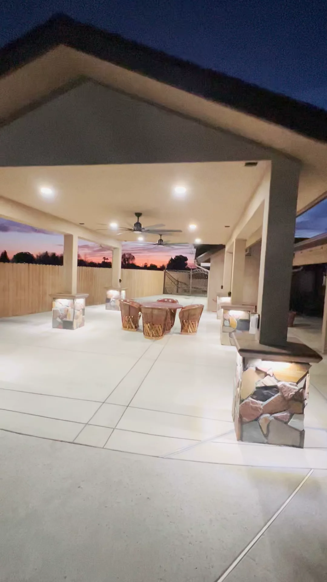 Full patio build with handcrafted stone pillars, built-in lighting, ceiling fan & outdoor electrical