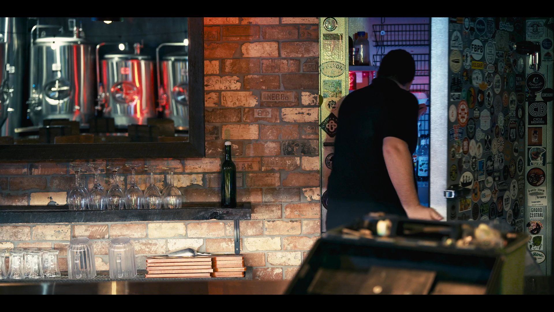 A technician receives a call in the middle of the night and promptly arrives at a bar to perform emergency repairs on the beer tap system.