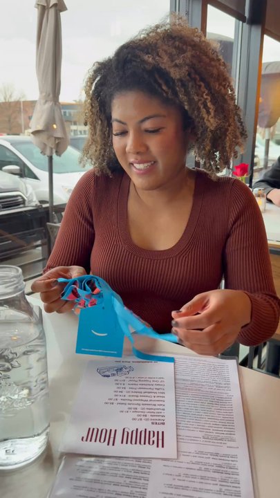 Viale Pizza & Kitchen - Blu opening her gift. - Pizza Near Me - Denver, Colorado