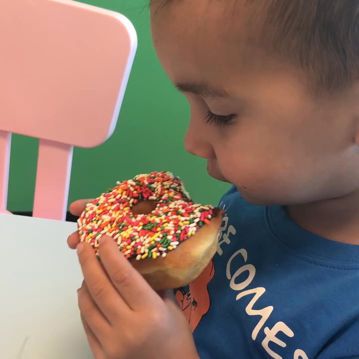 Santa Fe Donuts - He never actually eats the donuts that he asks for... But he devoured this one! - Donuts Near Me - Moore, Oklahoma