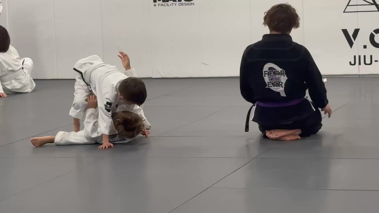 VOW BJJ - Coach Mike giving instruction and building the young men's confidence with encouragement as needed. - Brazilian Jiu-jitsu Near Me - Austin, Texas
