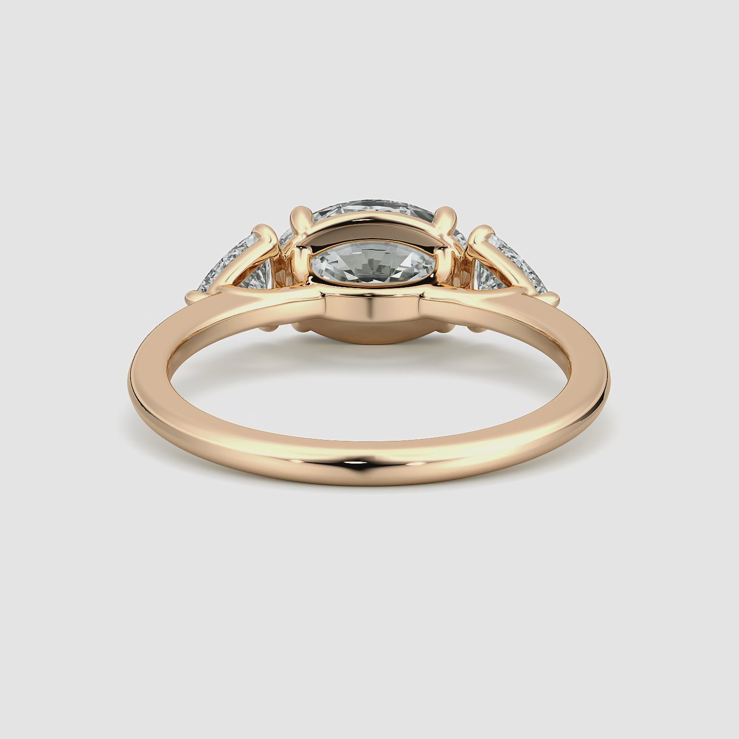 The Three Stone | Oval | 14k | Rose Gold | bandAccent: Plain | diamondOrientation: horizontal | sideStoneCarat: 0.25ct | sideStoneShape: Trillion | caratWeight: other