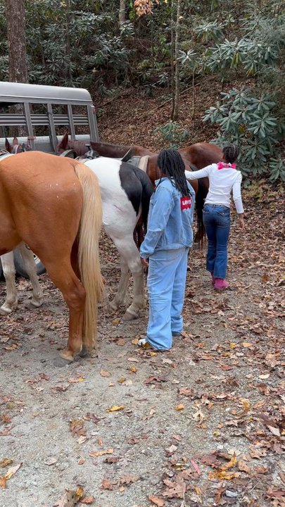 Saddle Up Trail Rides - Girls at the end petting the horses - Horseback Riding Near Me