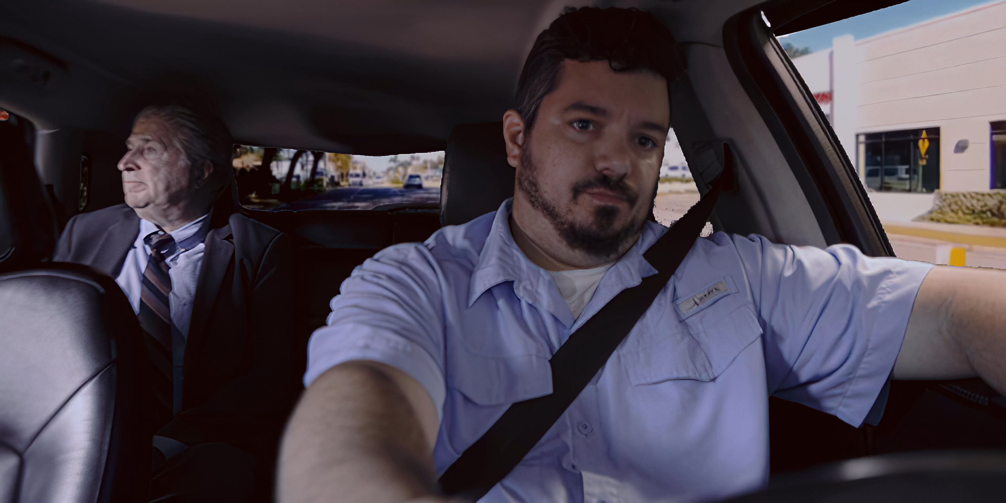 A driver transports a professional passenger through a sunny city environment. The scene alternates between the vehicle's interior perspectives and the passing urban streetscape.