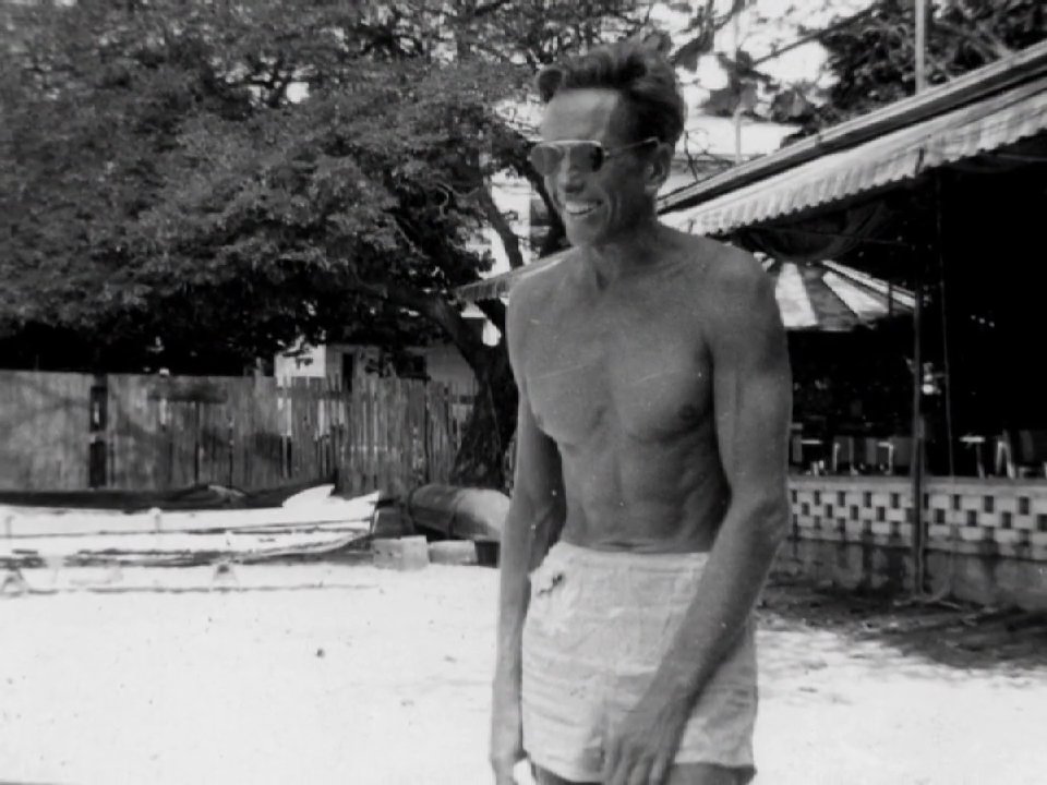 Mid-century footage captures leisure activities on Waikiki Beach, showcasing swimmers, outrigger canoes, and traditional hula performances against the backdrop of Diamond Head.