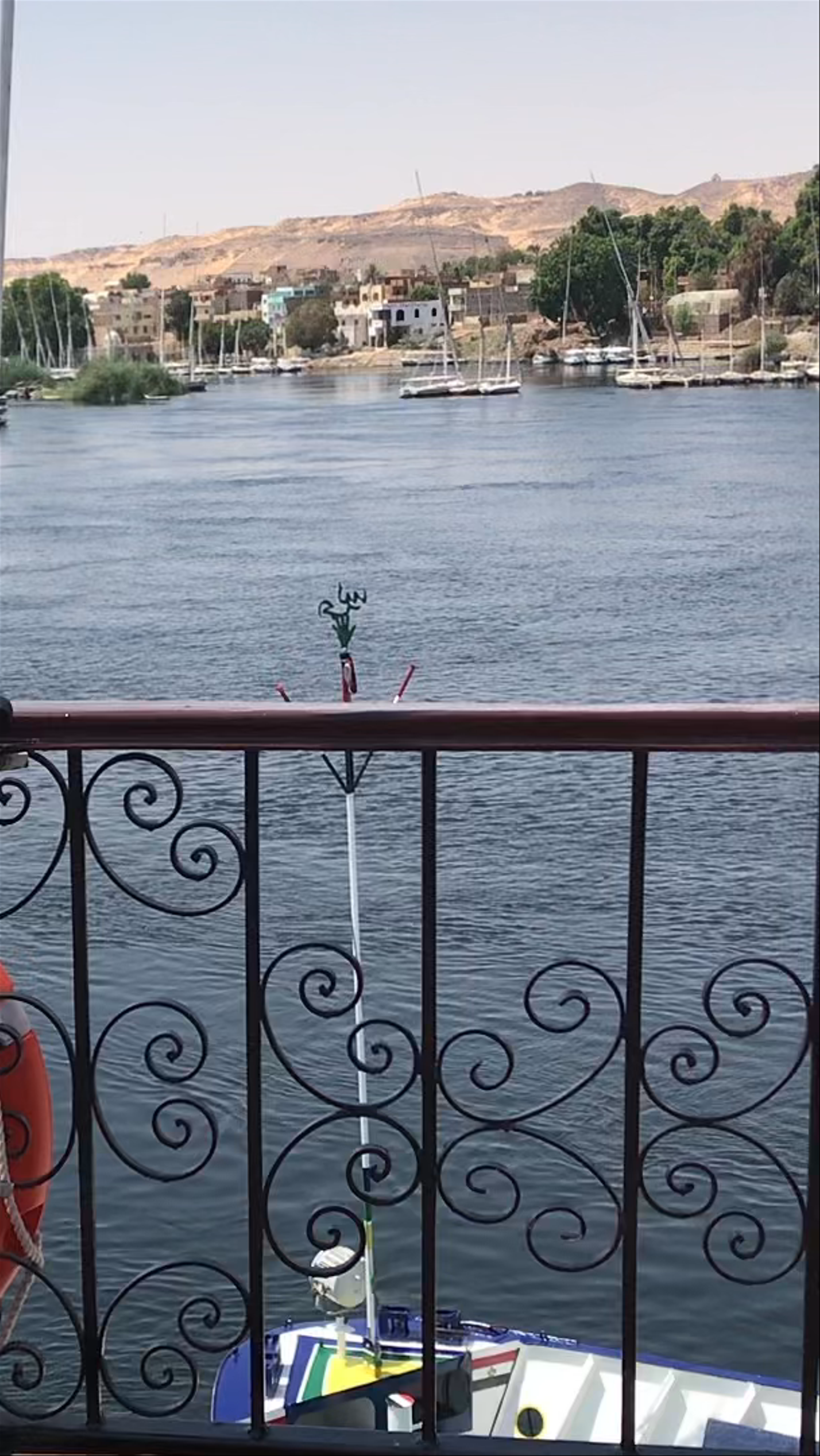 Serene Views of Aswan High Dam and Nile River from a Riverboat