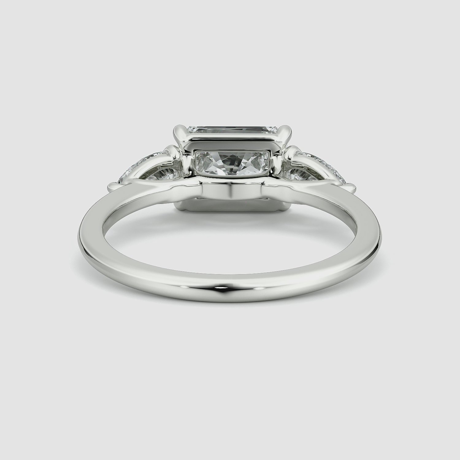 The Three Stone | Radiant | Platinum | bandAccent: Plain | diamondOrientation: horizontal | sideStoneCarat: 0.25ct | sideStoneShape: Pear | caratWeight: other