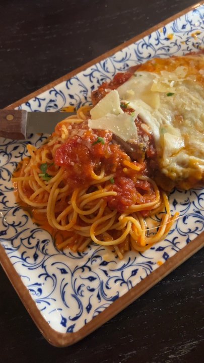 Cibo Cucina Italiana - Up close of the chicken CHICKEN PARMIGIANA - Italian Near Me - Plano, Texas