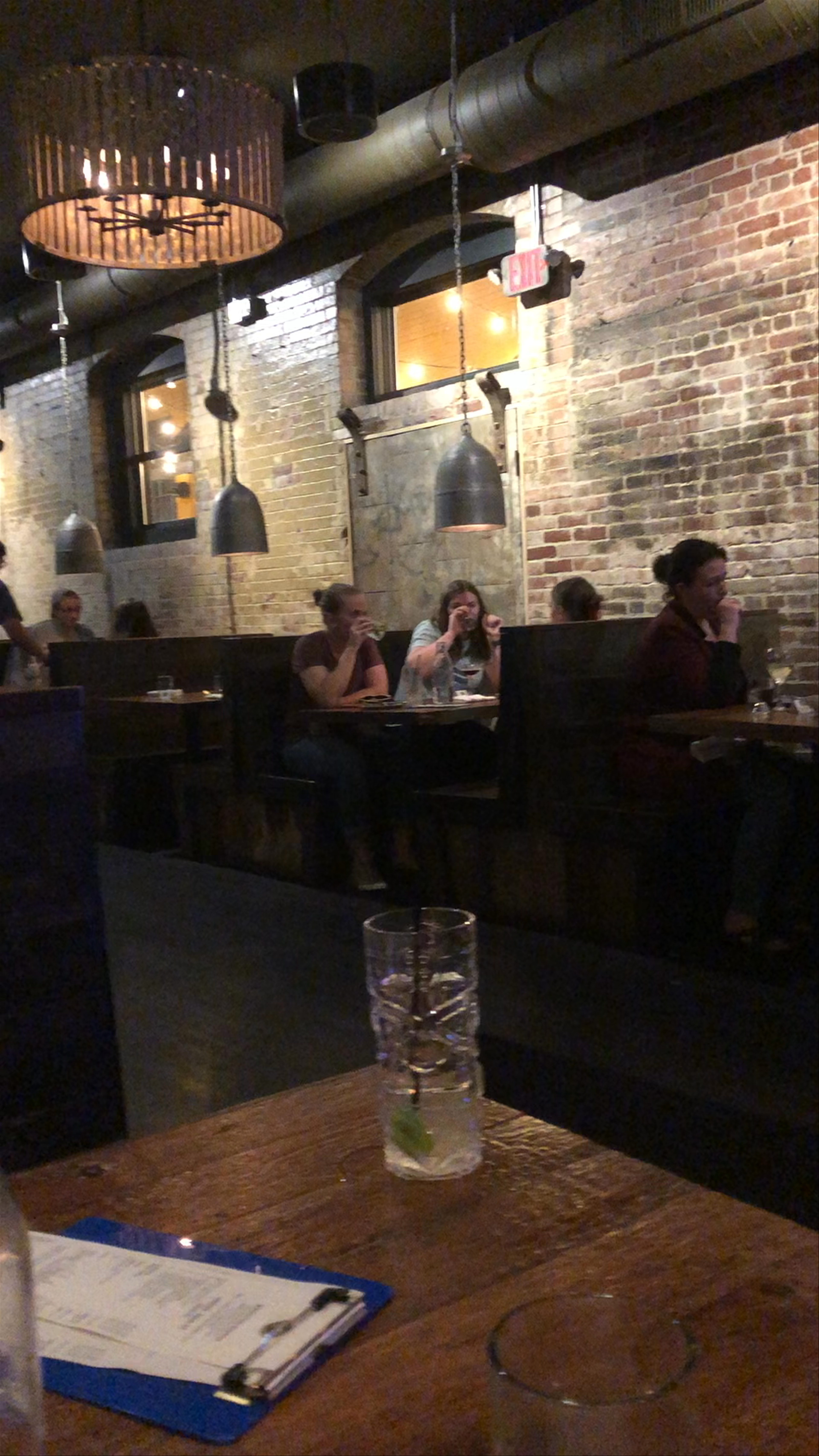 Evening vibes at a cozy industrial-style bar in Boston
