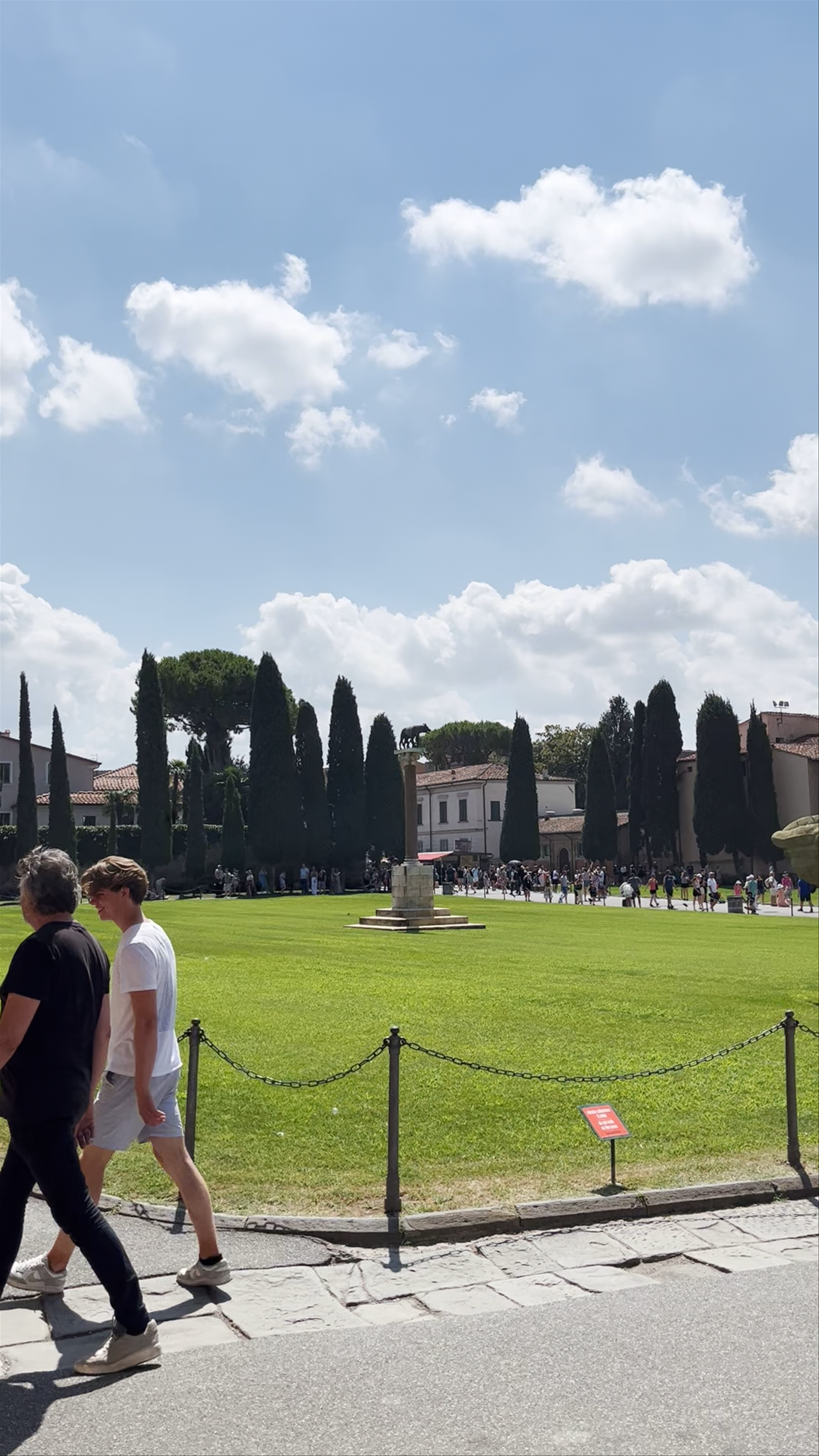 The Iconic Leaning Tower of Pisa Under a Brilliant Blue Sky