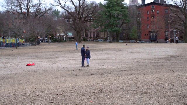 Couple playing with a frisbee