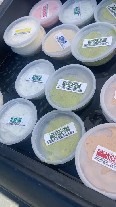 Greek Table - View of many varietals of hummus - Farmers Market Near Me - Alameda, California