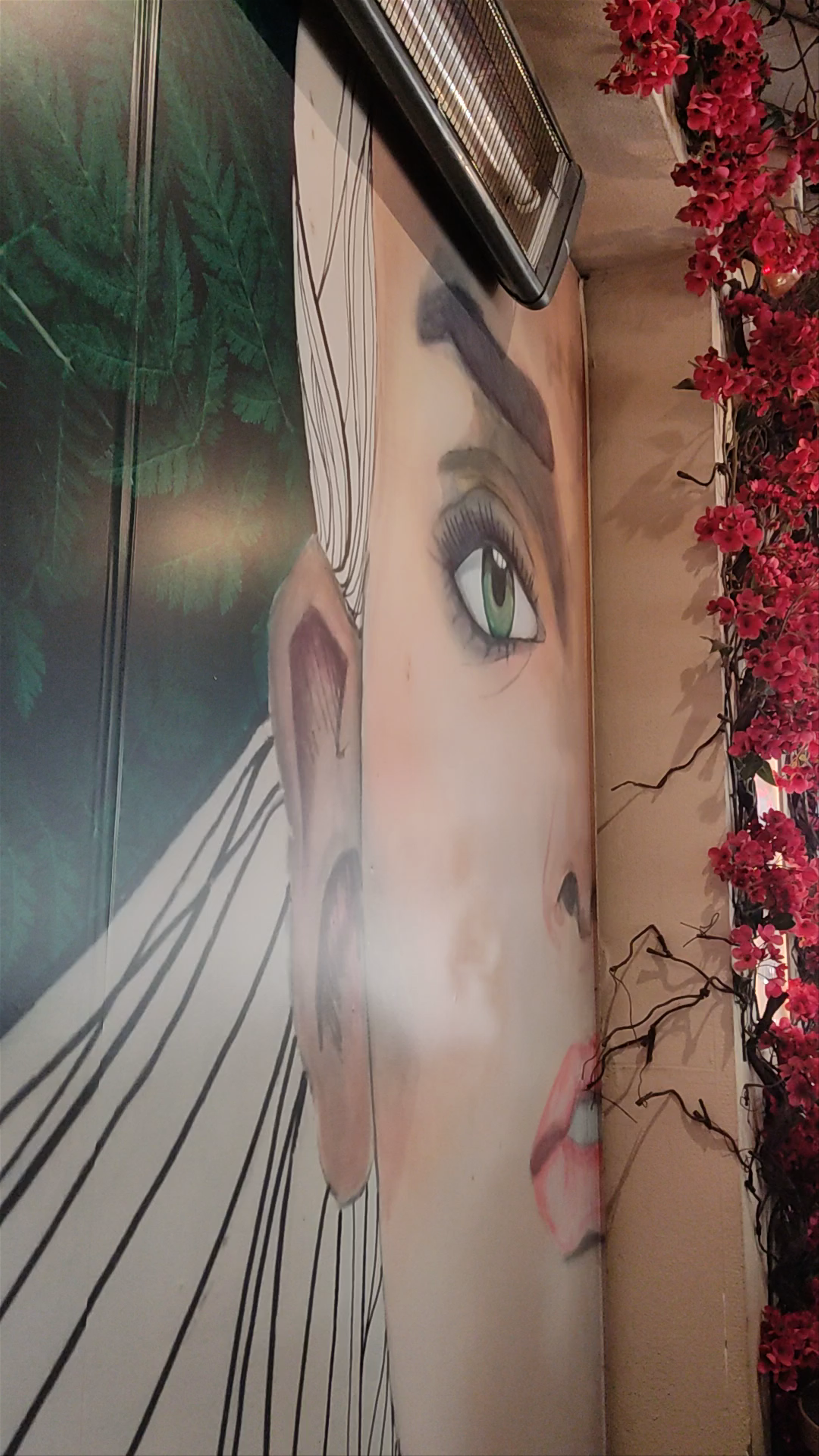 Vibrant Café Scene with Striking Wall Art in Ioannina, Greece