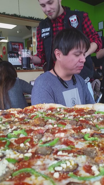 The Pizza Joint - Enjoying Vinne's creation - Pizza Near Me - El Paso, Texas