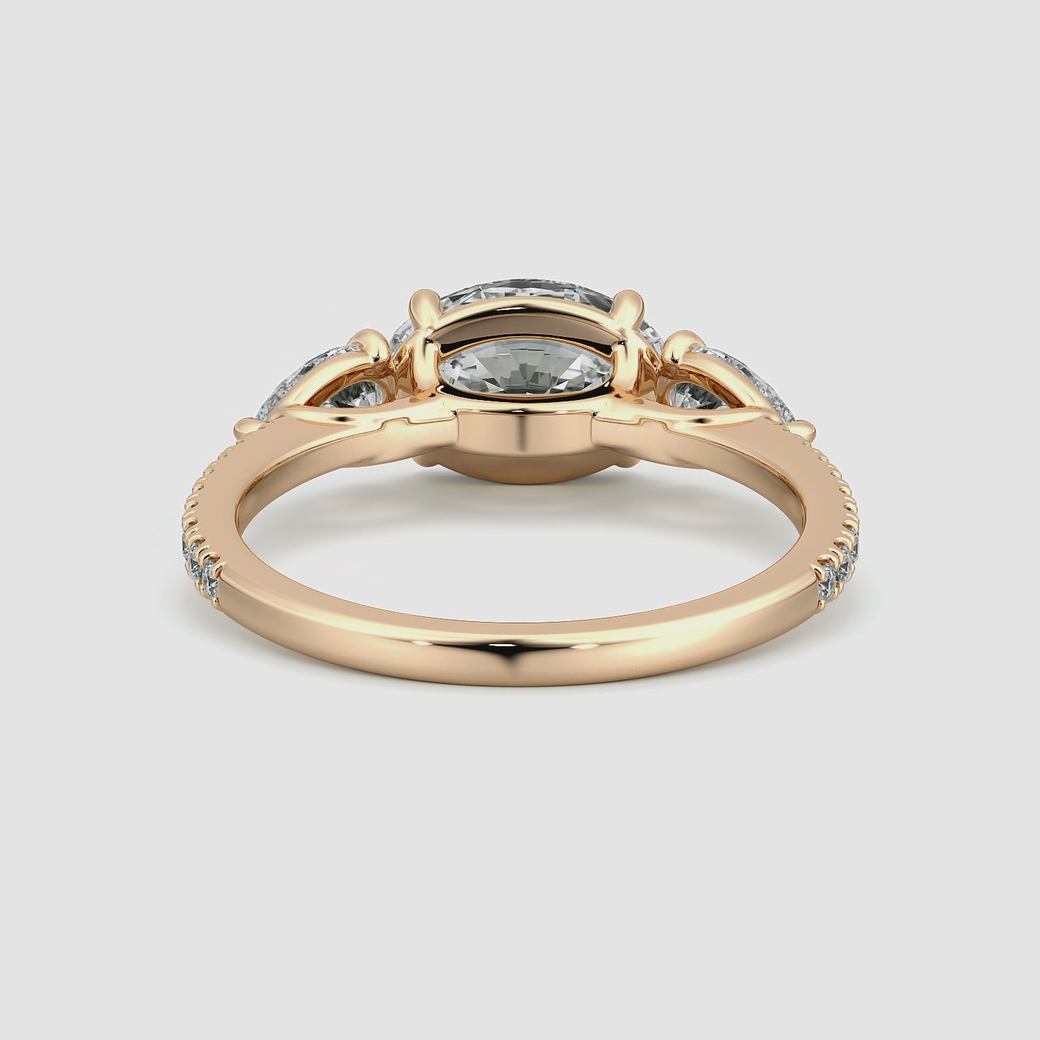 The Three Stone | Oval | 14k | Rose Gold | bandAccent: Pavé | diamondOrientation: horizontal | sideStoneCarat: 0.25ct | sideStoneShape: Pear | caratWeight: other
