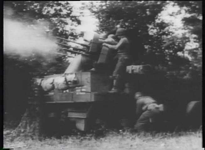 Historical battlefield footage displays active tank maneuvers and artillery engagement, contrasted with a modern-day interview featuring an elderly veteran reflecting on his experiences.