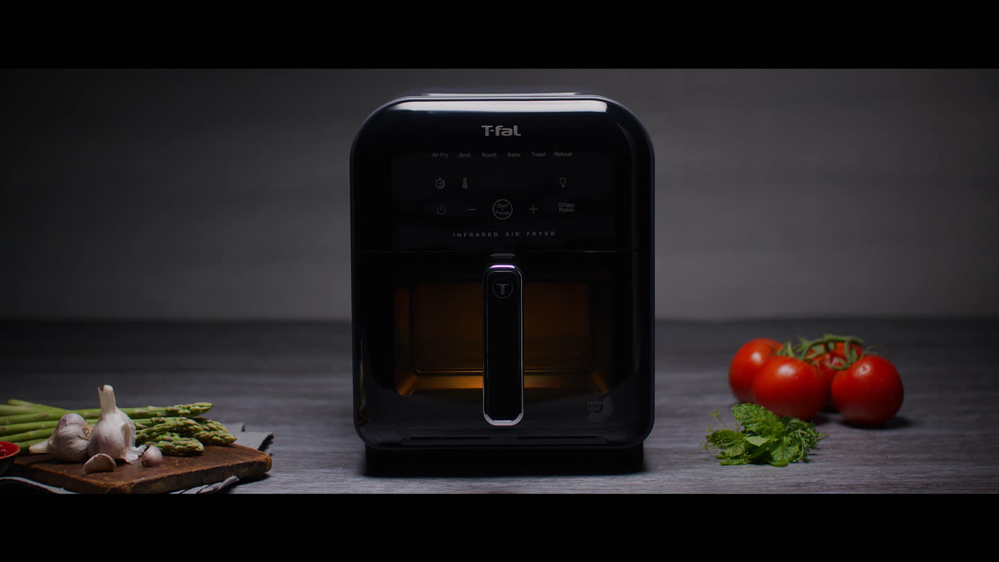 Film still: T-fal Infrared Air Fryer on a counter beside fresh ingredients