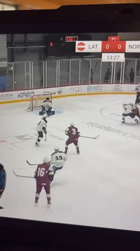 Markuss Ansons' Unstoppable Shot: Goalie's Helmet Lost!