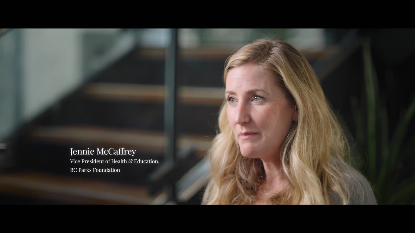 Film still: a BC Parks Foundation representative with an attentive expression during an interview