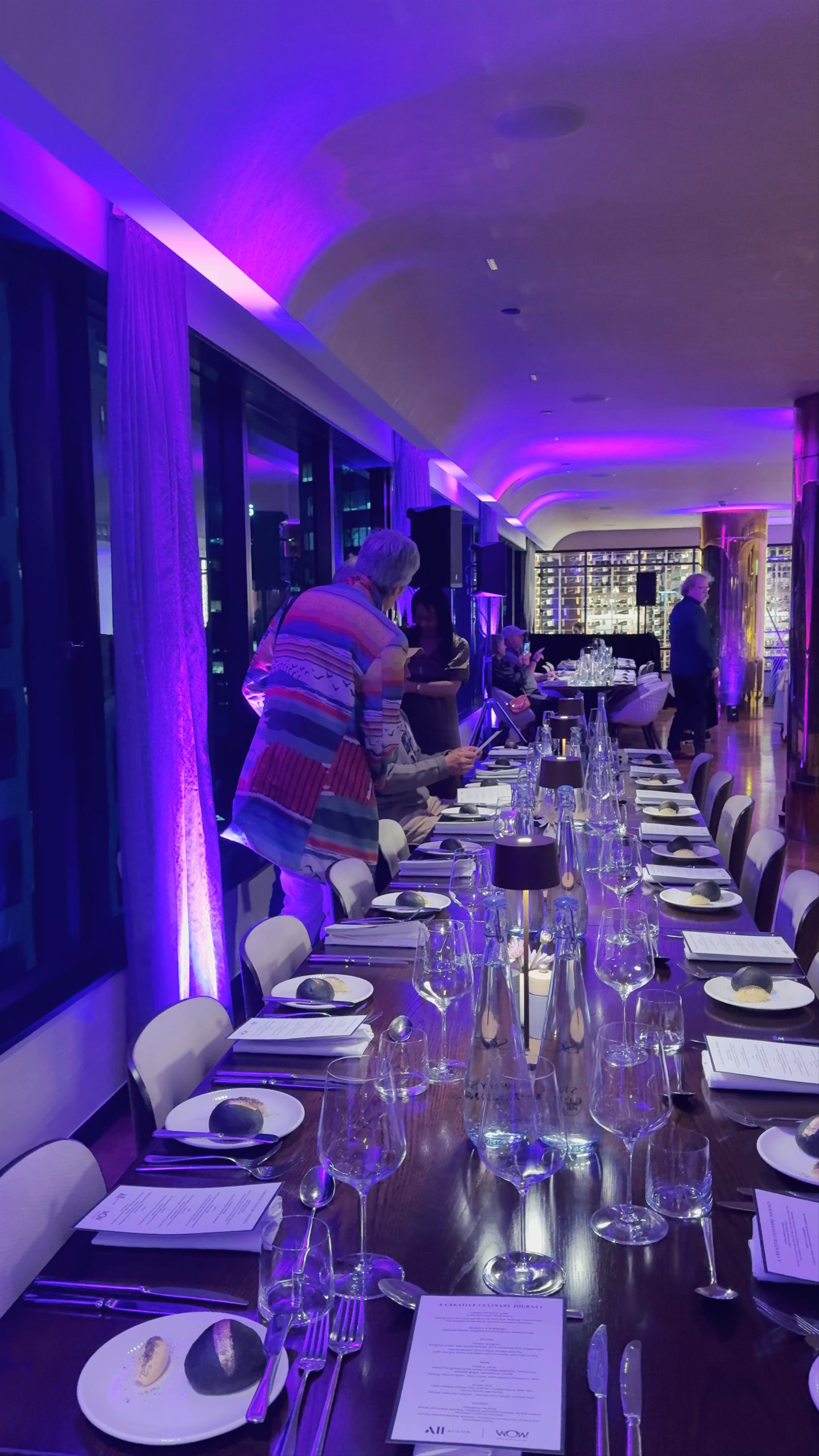 Elegant Dinner Event with Vibrant Purple Lighting in Auckland CBD