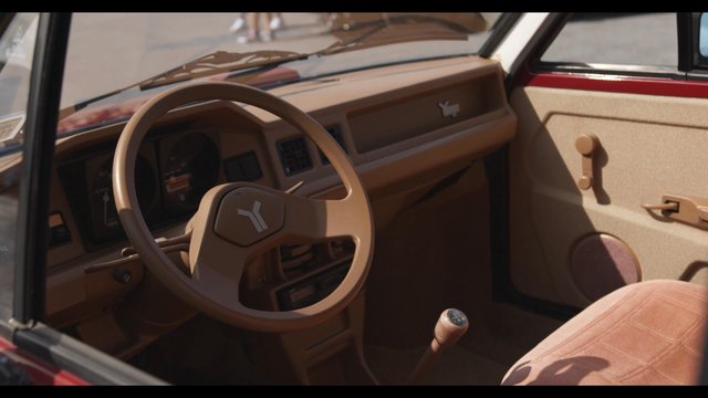 View inside a vintage Yugo through the driver’s window
