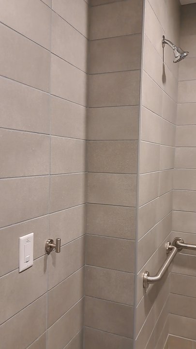 Pickleball Kingdom - Women's restroom has 1 handicapped accessible shower room. No soap or shampoo. 2 hooks, 1 bench, and 1 electrical outlet. - Pickleball Near Me - Roseville, California