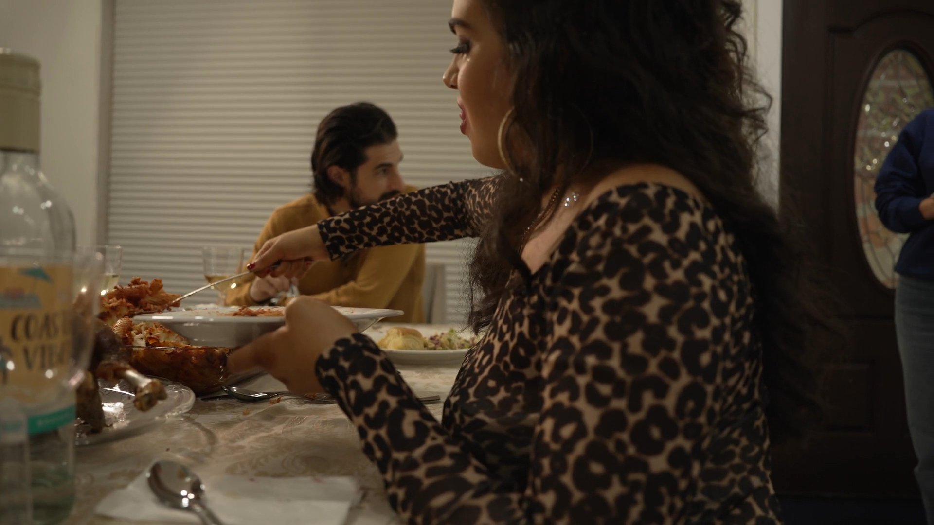 A tense domestic dinner gathering transitions into sequences of conflict and underlying hostility. The narrative shifts between intimate household moments and menacing imagery, suggesting a volatile family dynamic.