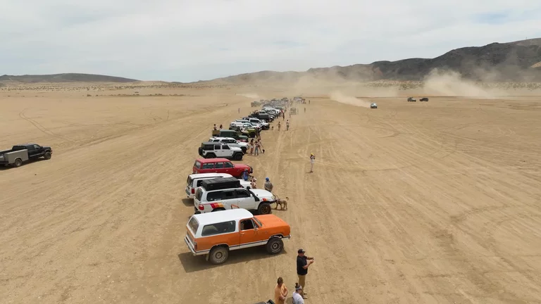 Drone video overlooking vehicles in Joshua Tree