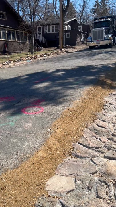 Chautauqua Park - A cottage street that has had lines buried and a truck leaving the grounds with a dirt load - Parks Near Me - Boulder, Colorado