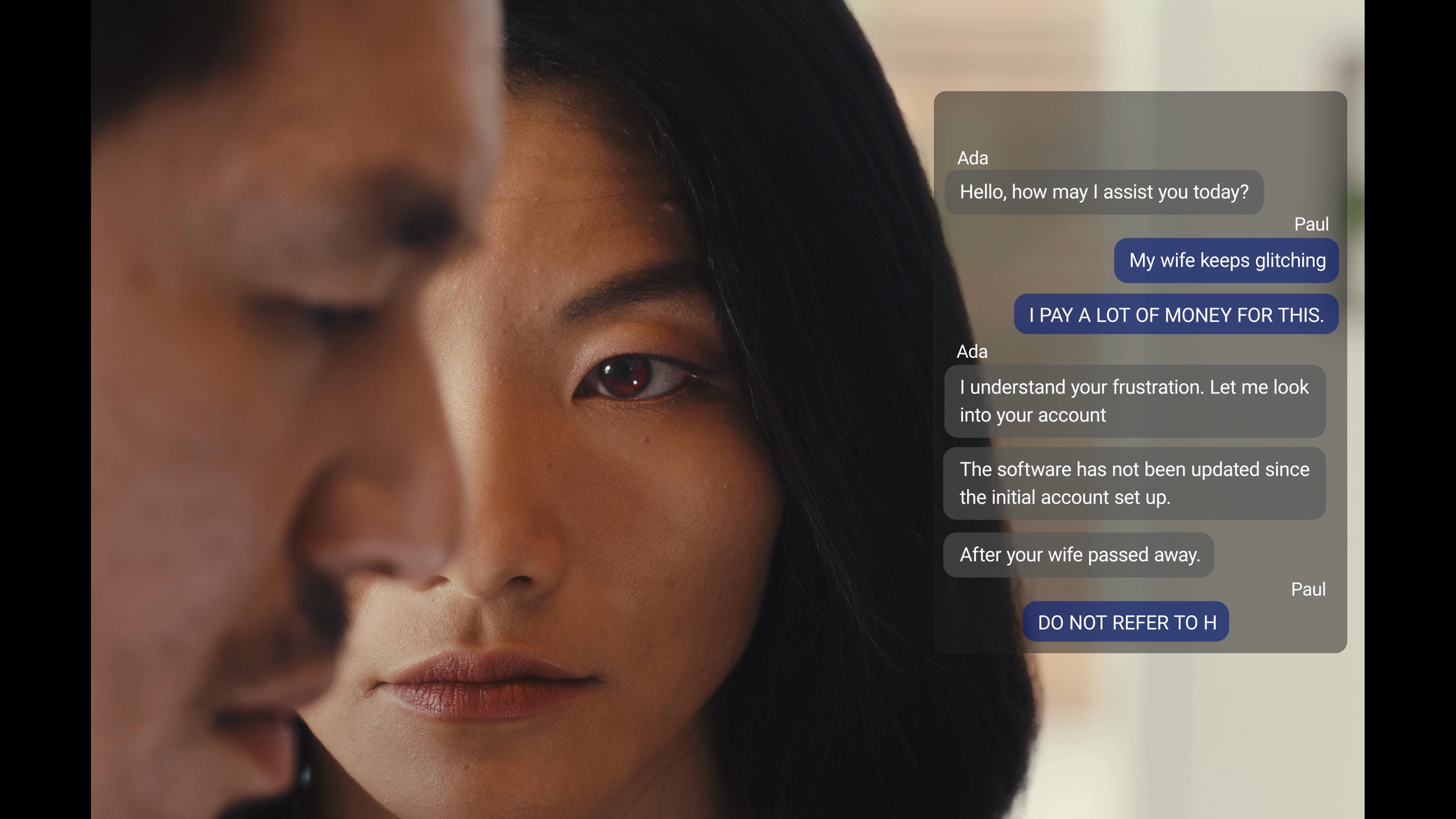 A grieving man engages in a tense digital chat with an automated customer support bot regarding software errors, leading to an unsettling interaction about his late wife.