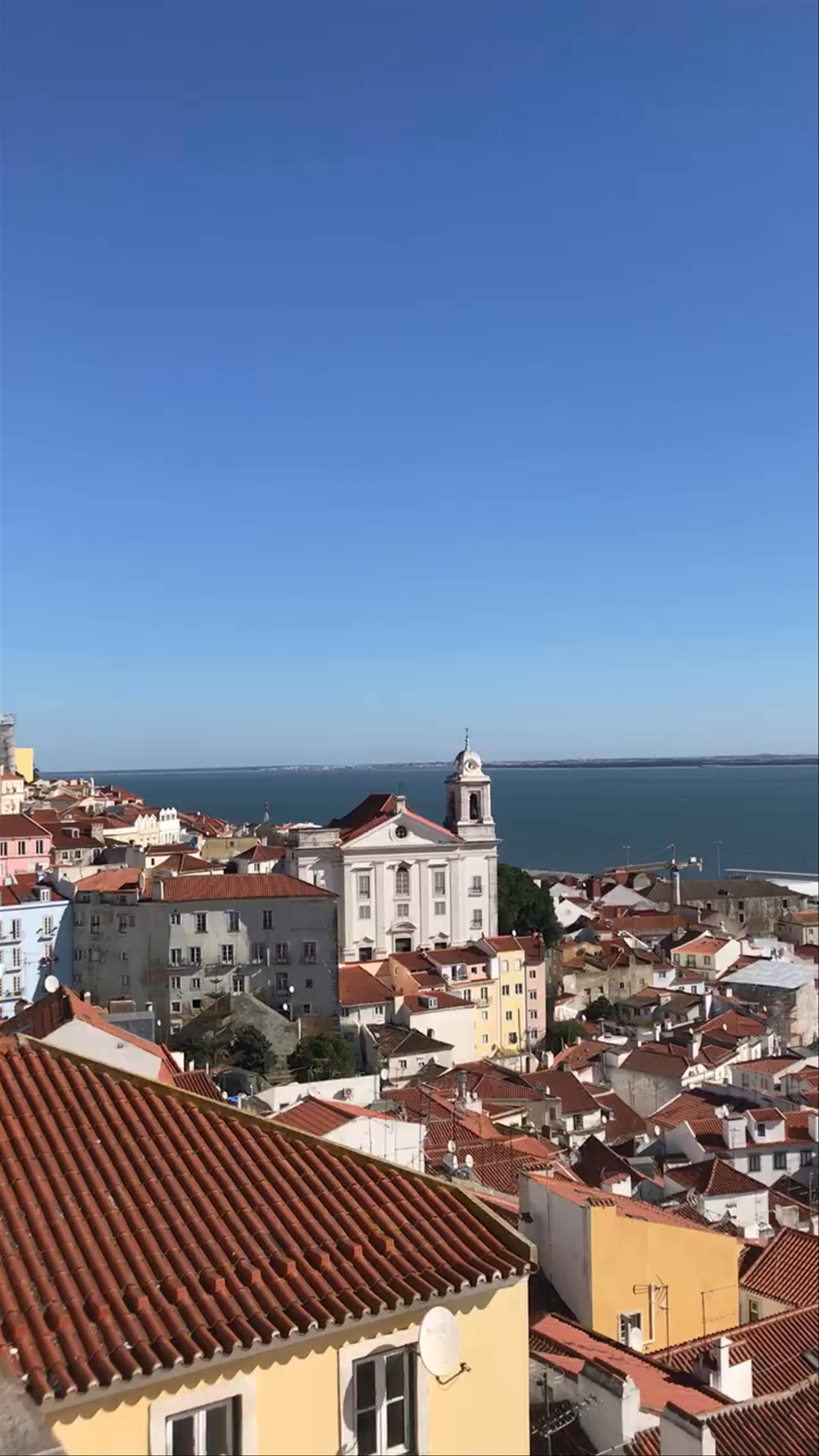 Breathtaking Alfama Views Over Lisbon's Rooftops and Tagus River
