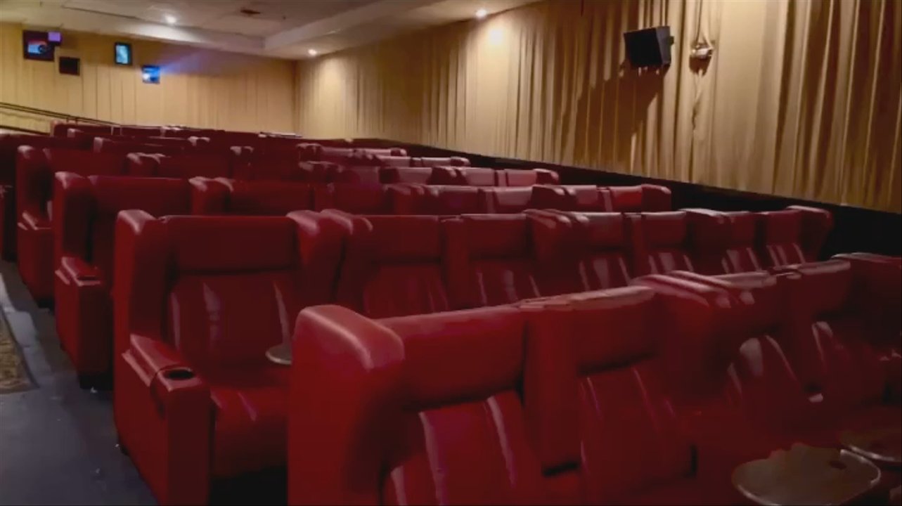 Chatham Hickory Cinema - LUXURY GLIDER SEATS feature convenient swivel tray tables and flip-up armrests. Lean back, relax, and enjoy the moviegoing experience! - Cinema Near Me - Chatham, New Jersey