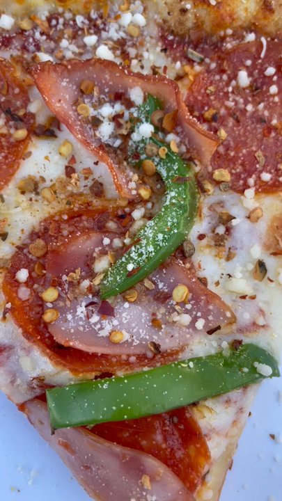 Big Slice Pizza - A slice with parm and chili flakes, delicious! - Pizza Near Me - Fullerton, California