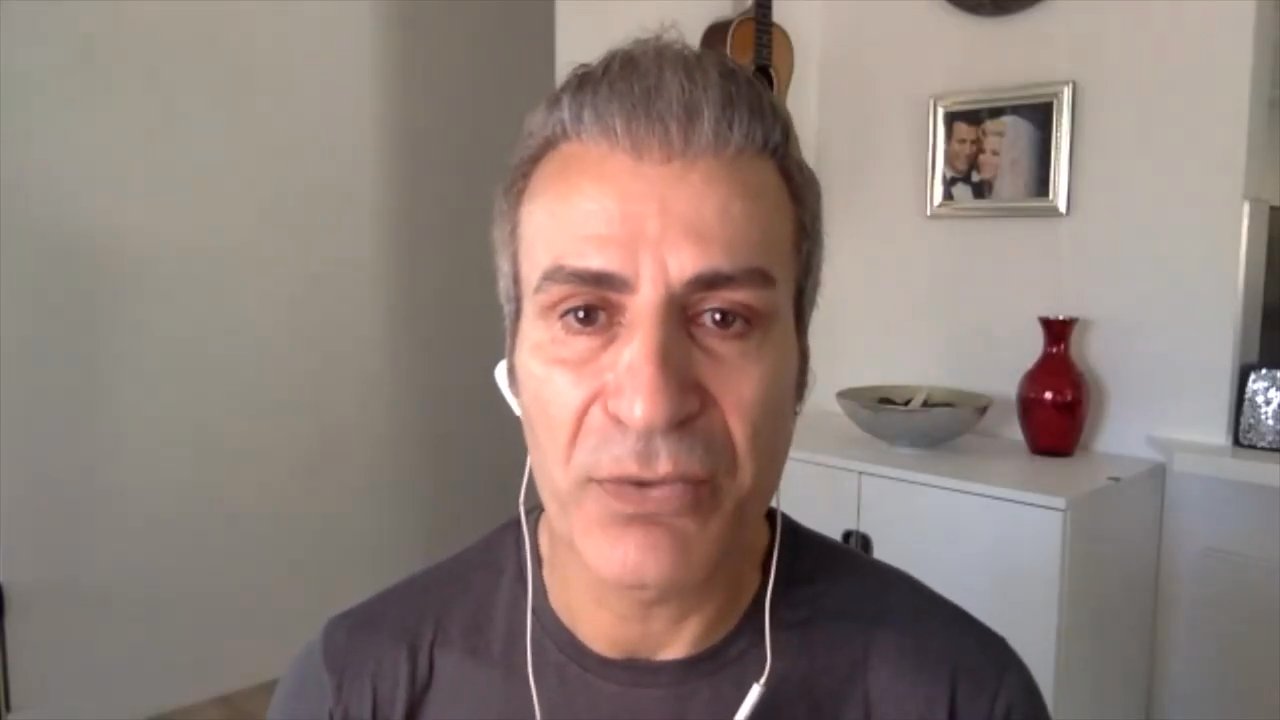 Amir Rostami, the husband of Dee Weiss, delivers a direct address to the public in a formal interview format. The segment concludes with a brief inclusion of footage showing Dee Weiss inside a vehicle.