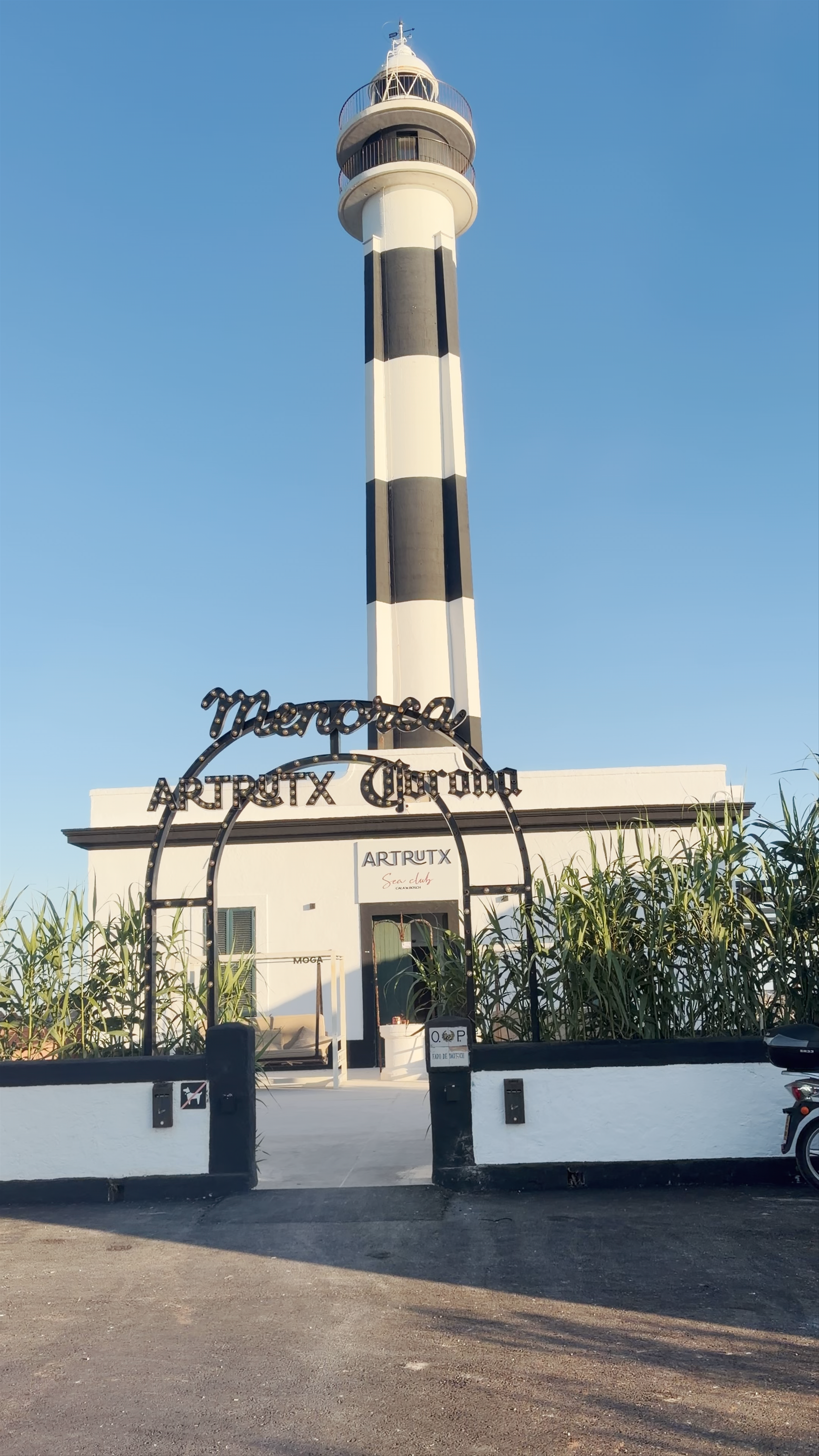 Artrutx Lighthouse: Majestic Coastal Beacon in Cap d'Artrutx, Spain