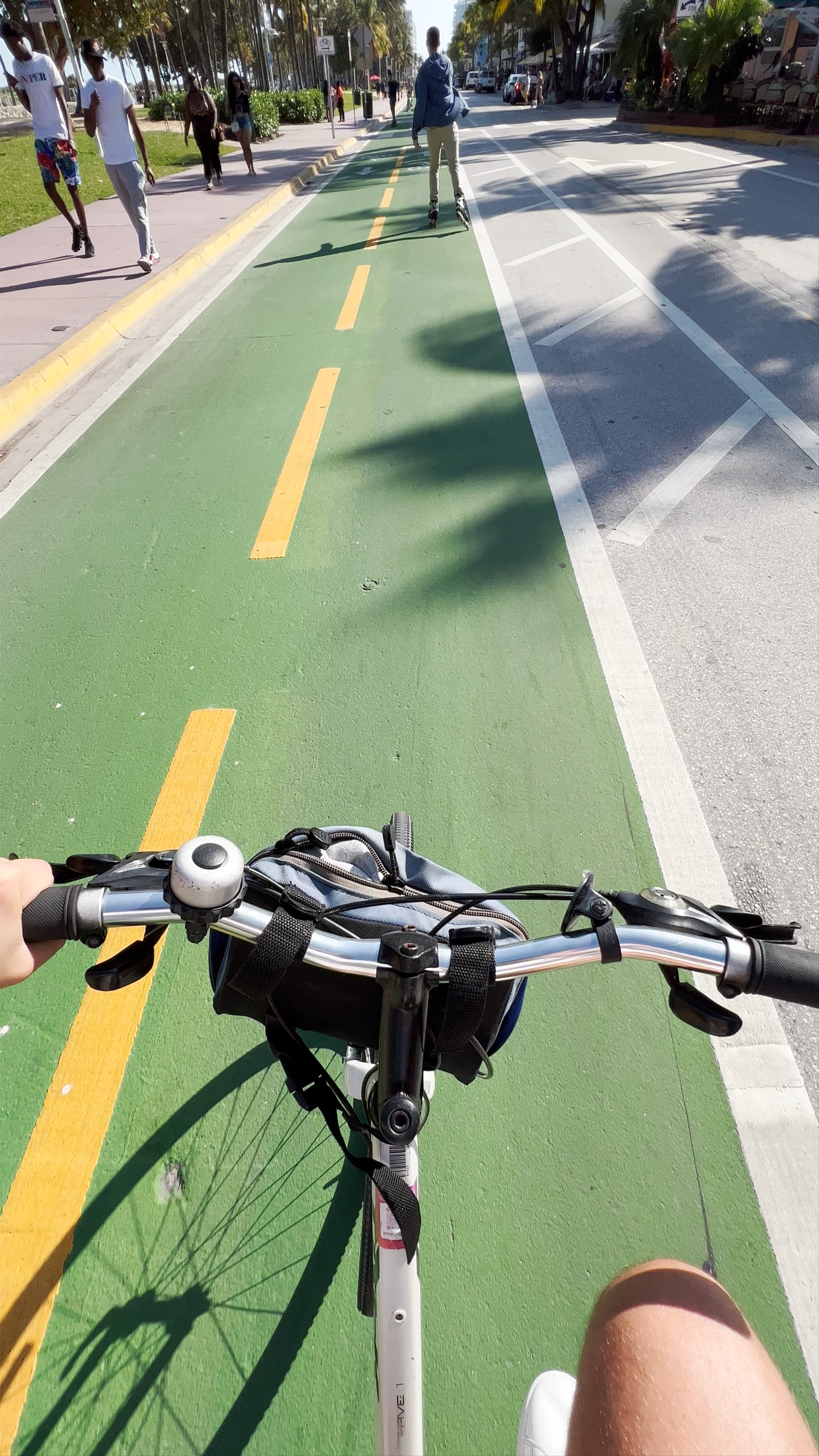 Cycling Along the Vibrant Green Bike Lane in Miami Beach, Florida
