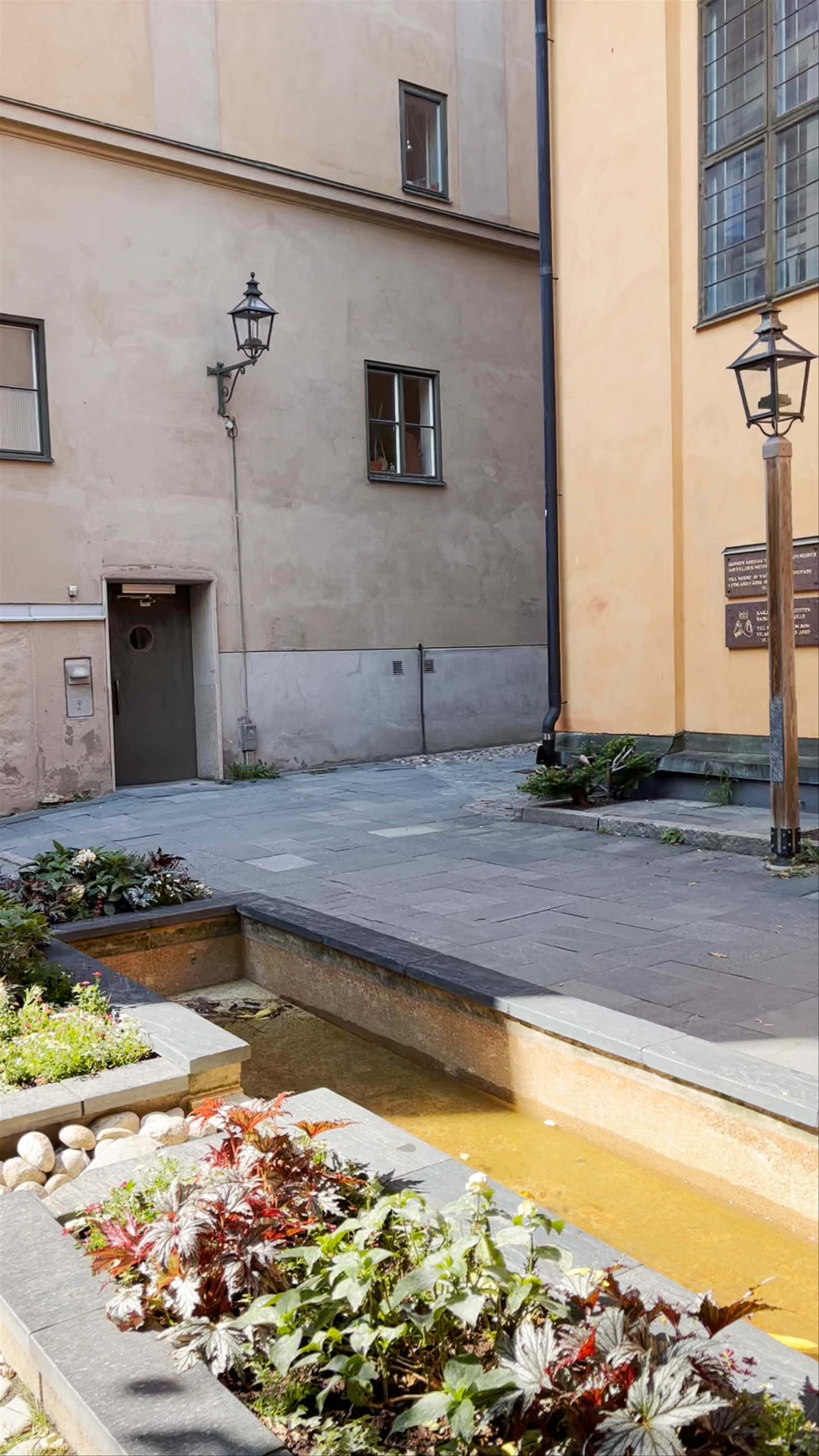 Iron Boy: Contemplative Sculpture in Stockholm’s Historic Courtyard