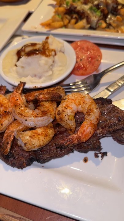 Sam's Steak & Grill - Poutine Fries 3 Volcano Burgers Surf N Turf w/ salmon & Wild Rice Surf N Turf w/ Shrimp & Mashed Potatoes Ribeye 14 oz. w/ Mashed Potatoes - American Near Me - Valley Stream, New York