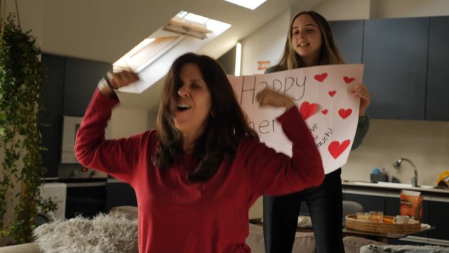 Mom and daughter dancing for Mother's Day