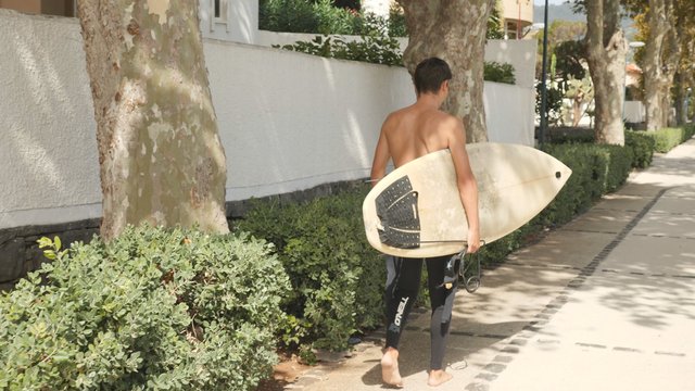 Carrying a surfboard