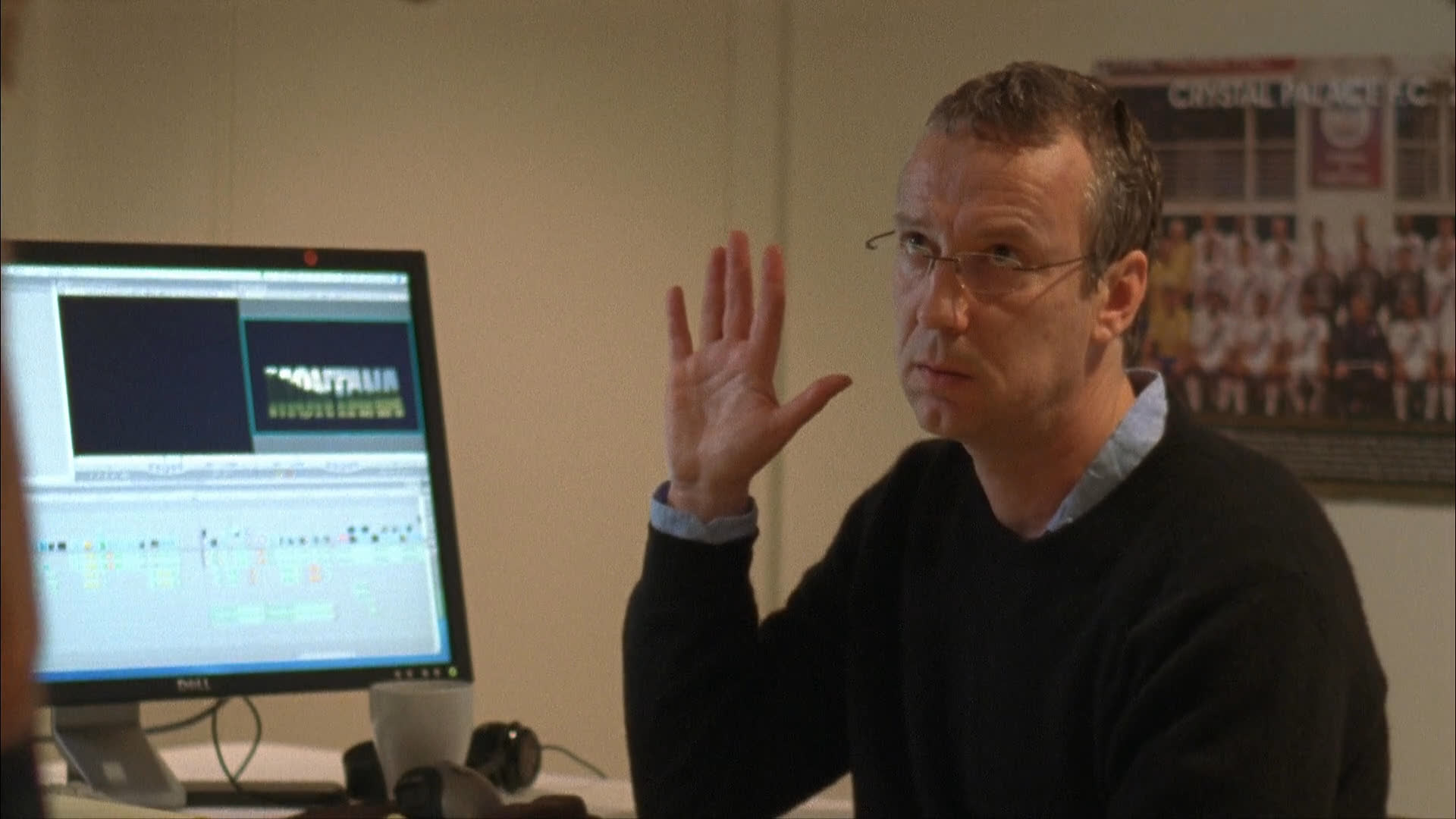 Two individuals engage in a tense, argumentative discussion within an office environment, intercut with footage of an exterior meeting at a storefront.