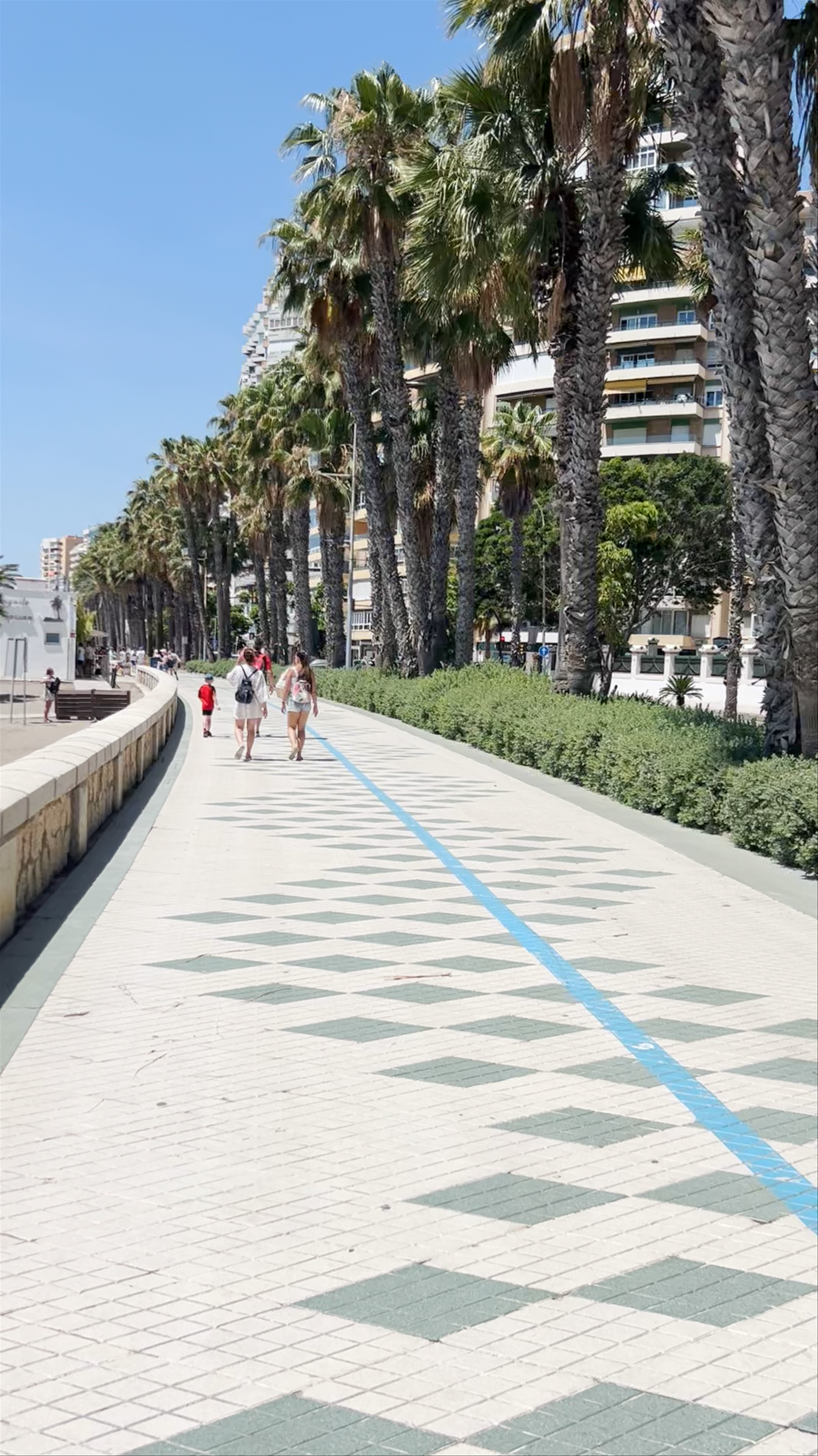 Sunny Stroll Along Playa de la Malagueta Promenade in Málaga