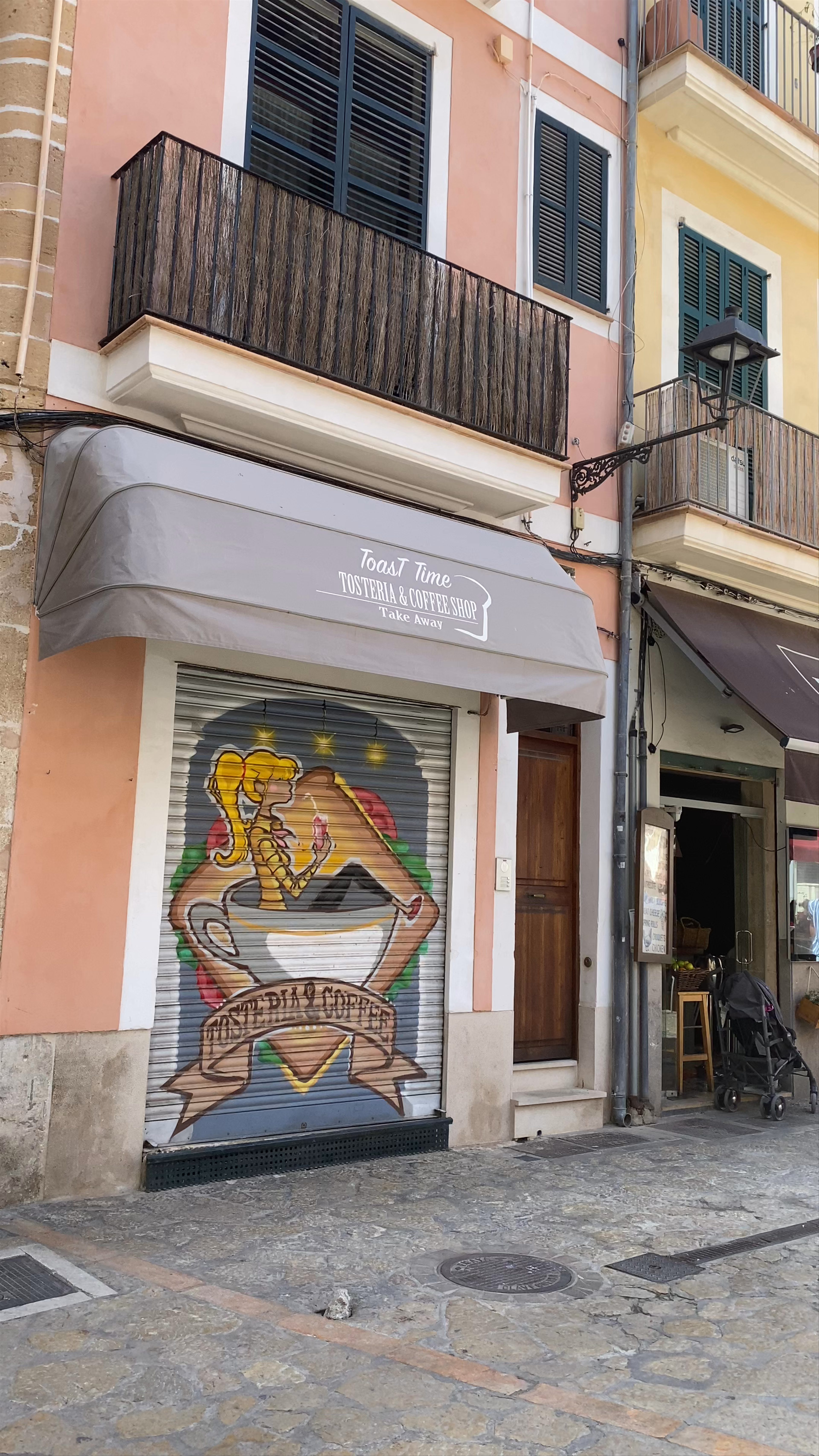 Sunlit Stroll Through Plaza d'En Coll, Palma
