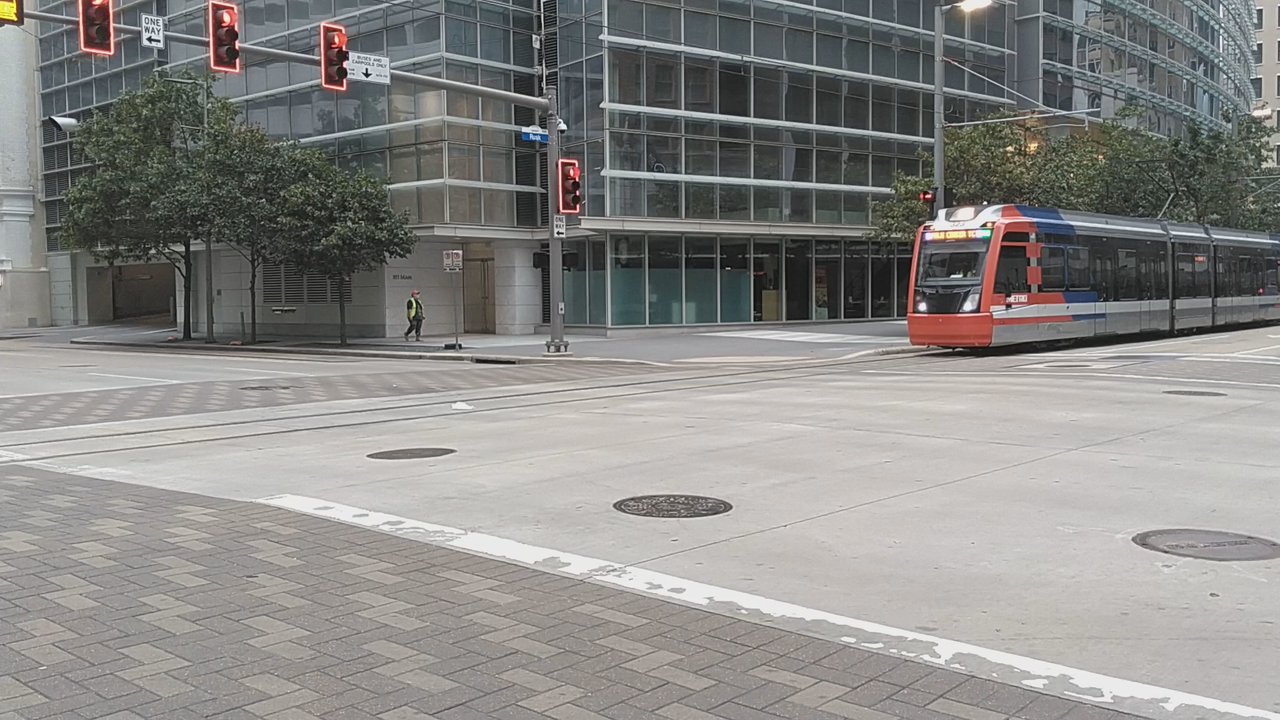 Houston Metro - Houston Metro trains can be seen plying the downtown streets, right next to impressive high rises. - Public Services & Government Near Me - Houston, Texas