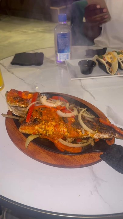 Rhay's Restaurant - Coach of the day fish. Sizzling and smoky - African Near Me - Houston, Texas