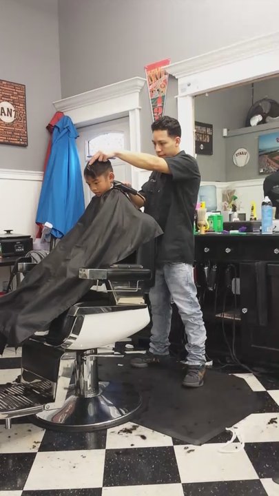 First Class Barbershop - My son getting his haircut by David... Love how very communicative he is checking in on my son hair. - Barbers Near Me - Concord, California