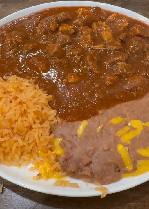 Familia Restaurante - Piping hot, pork guiso. - Seafood Near Me - Irving, Texas