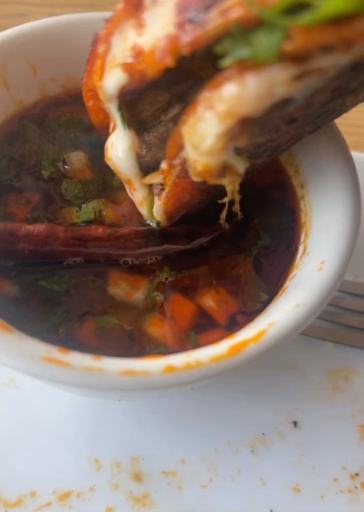 Zacatecas - Dipping the Quesabirria in the consume - Mexican Near Me - Franklin Park, Illinois