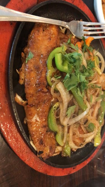 Anmol Barbecue - Fish tikka sizzling away - Pakistani Near Me - Chicago, Illinois