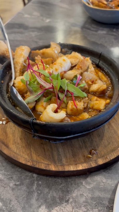 Dan Da - Sizzling CP8 with squid, pork, and shrimp paste. SO GOOD and just the right amount of spicy! - Vietnamese Near Me - Aurora, Colorado